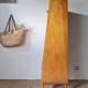 Vintage 1950s wooden secretary with tapered legs and mint interior.