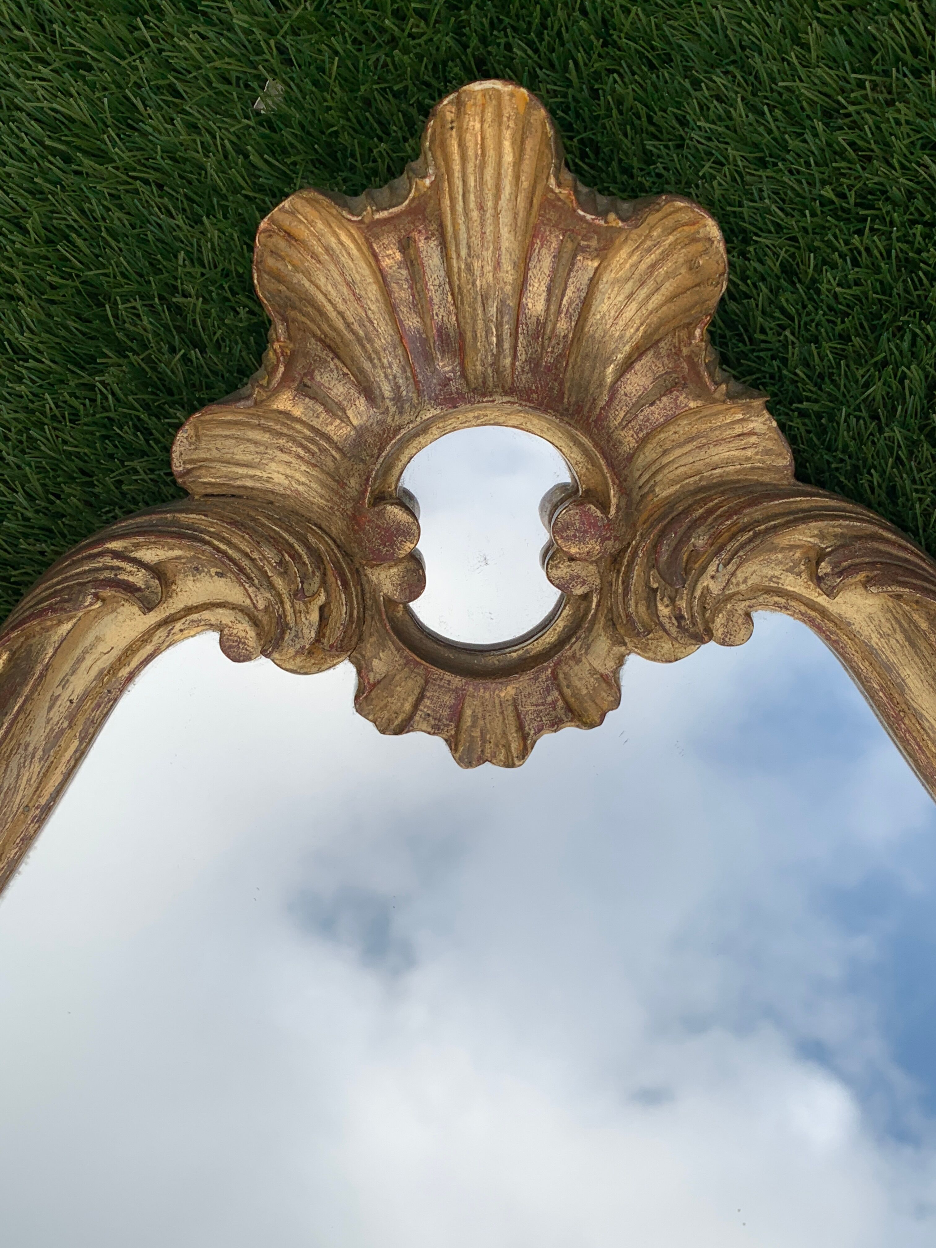 Old mirror in carved wood and gilded leaf, Louis XV rocaille style, twentieth century 59x87cm