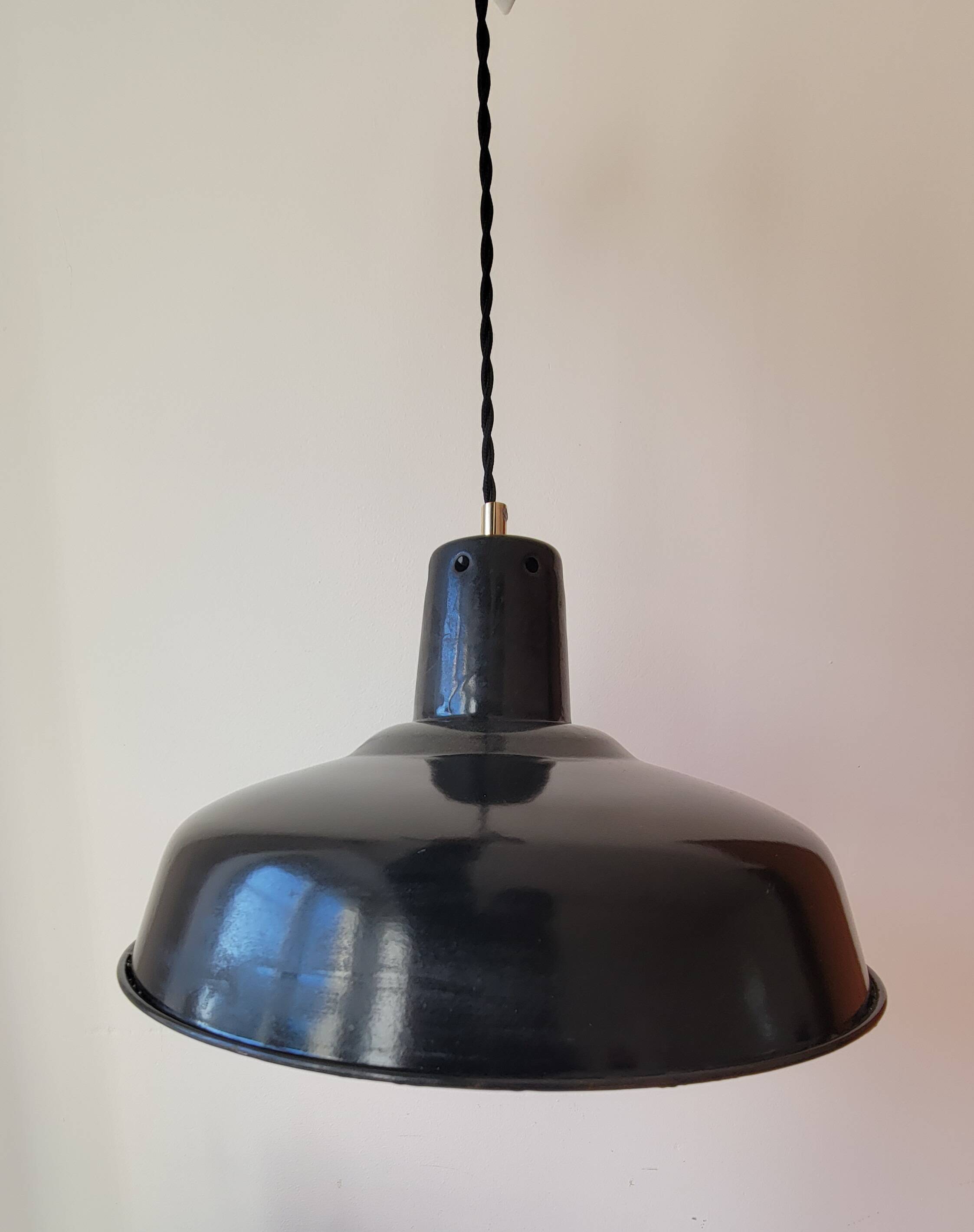 Duo of white and black enameled sheet metal pendants