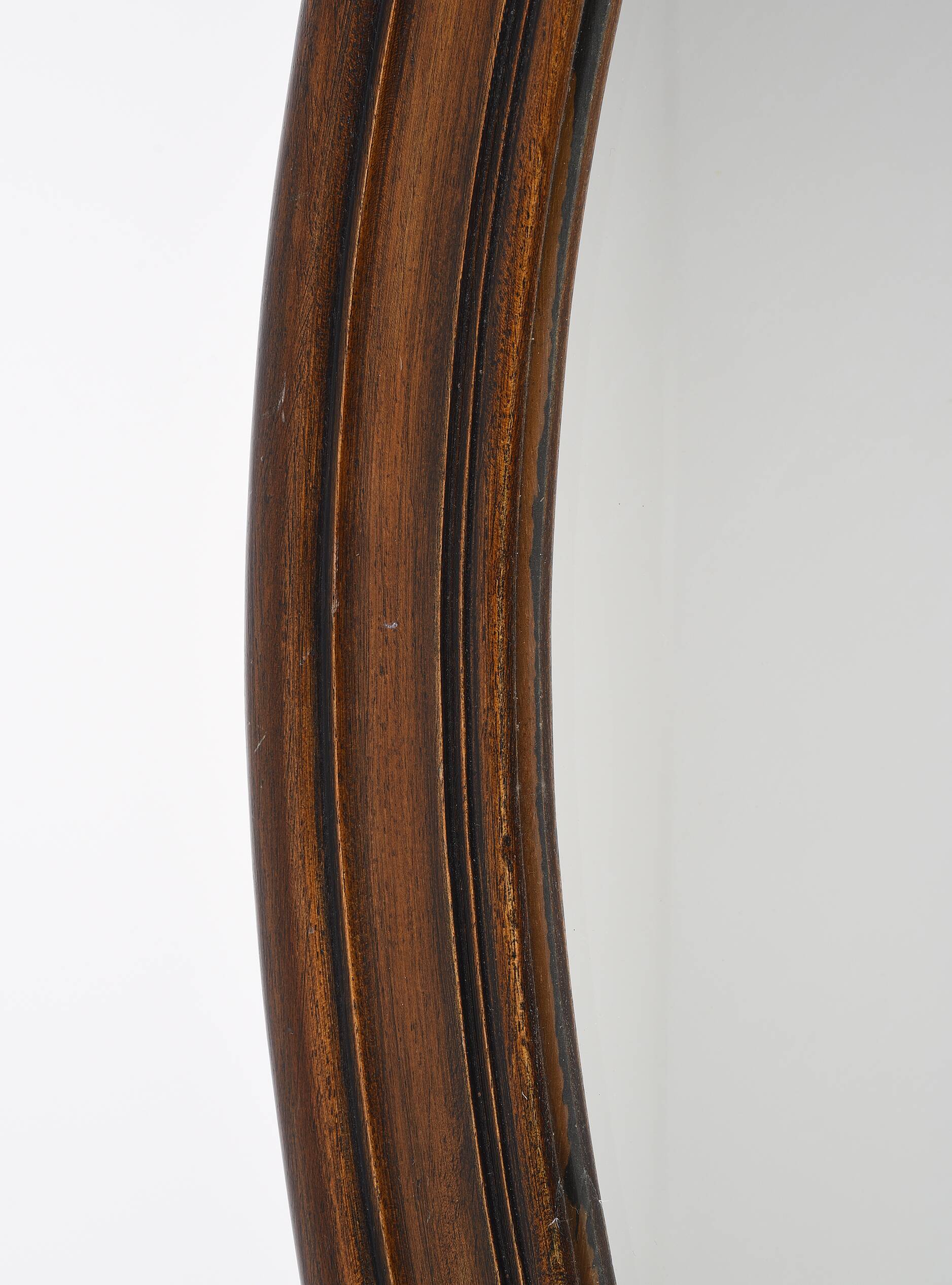 Large old oval wooden mirror