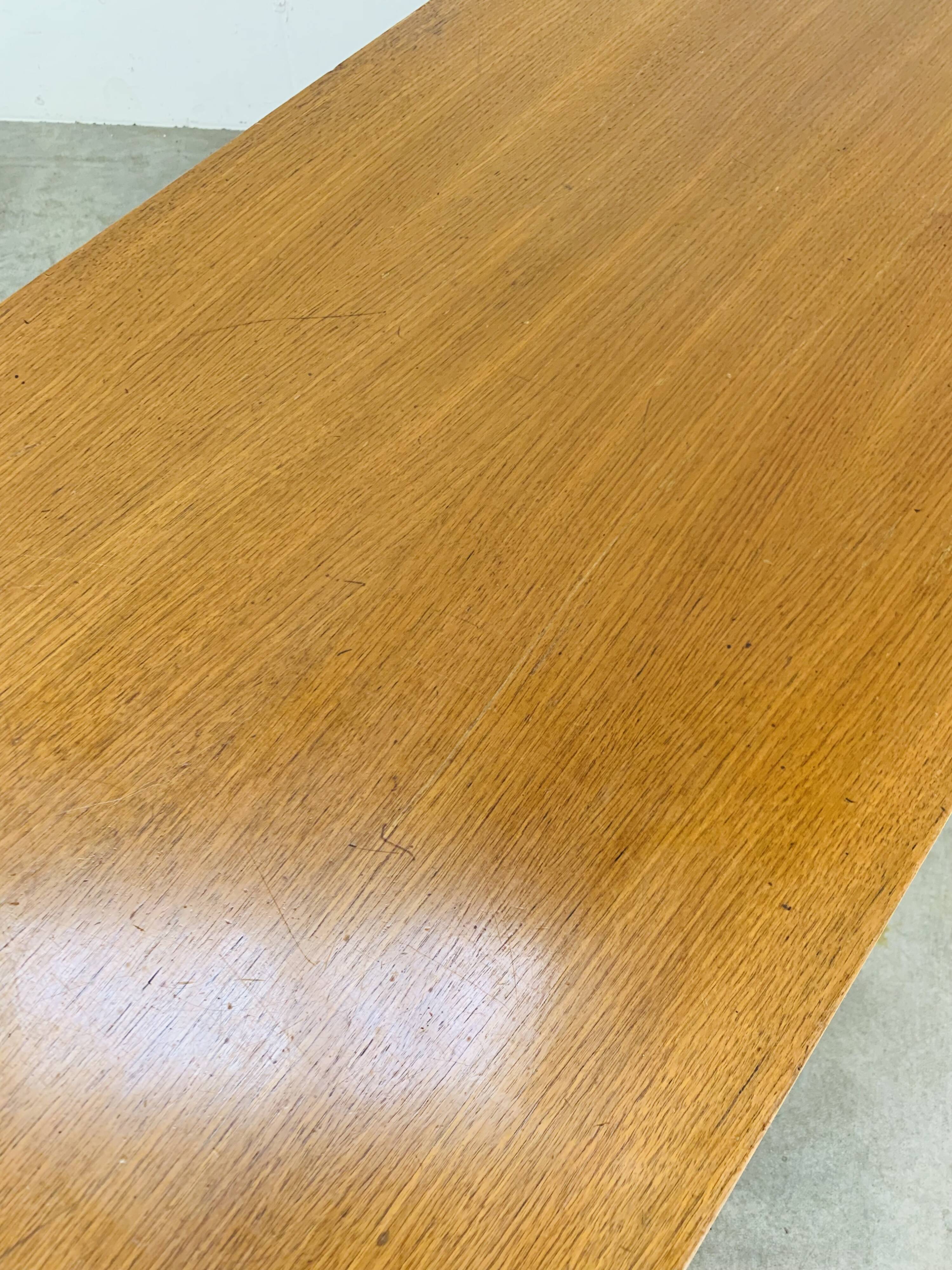 1950s modernist coffee table, wood and black metal.