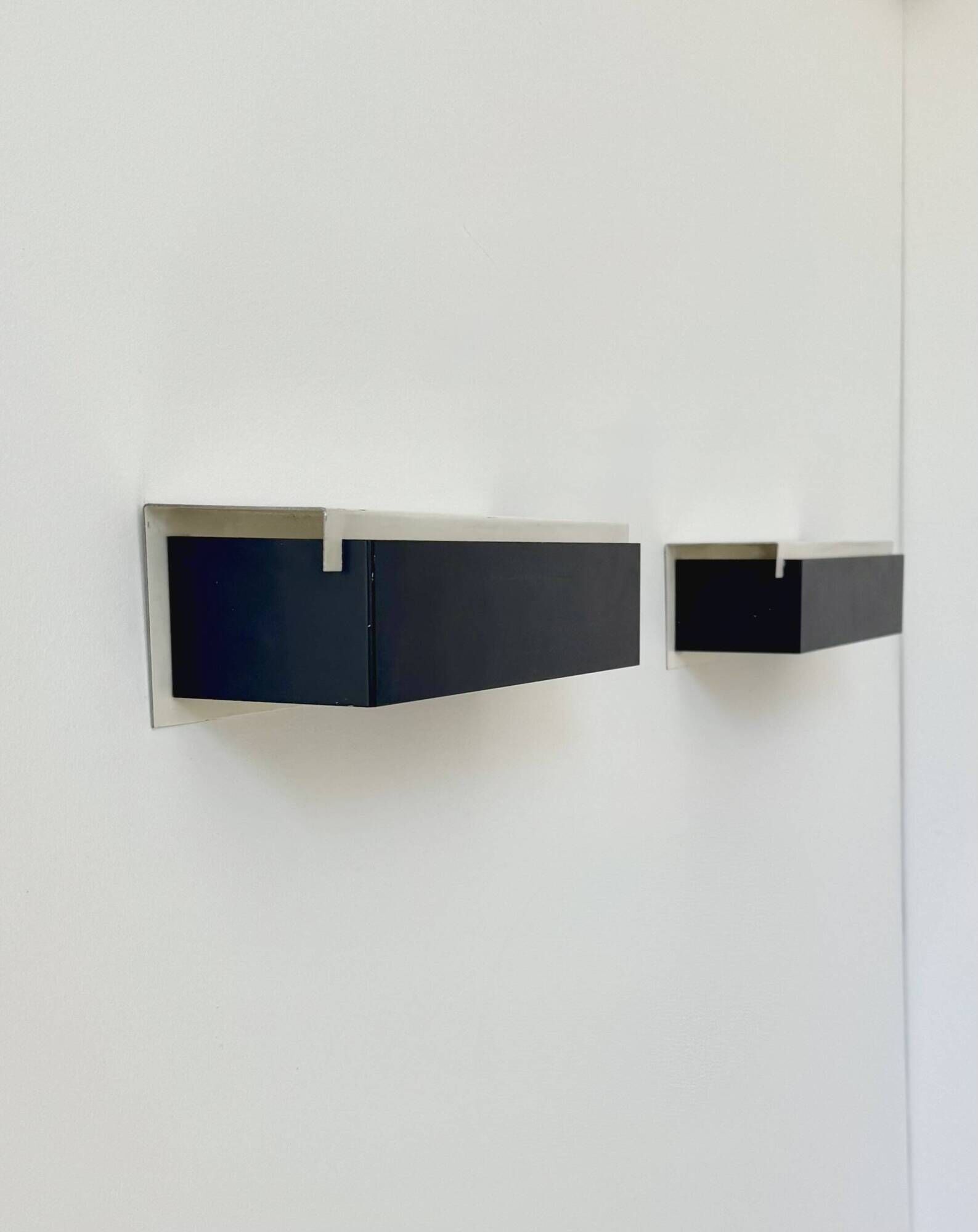 Pair of vintage wall sconces, painted black and white metal, Sweden 1970.