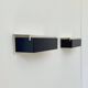 Pair of vintage wall sconces, painted black and white metal, Sweden 1970.
