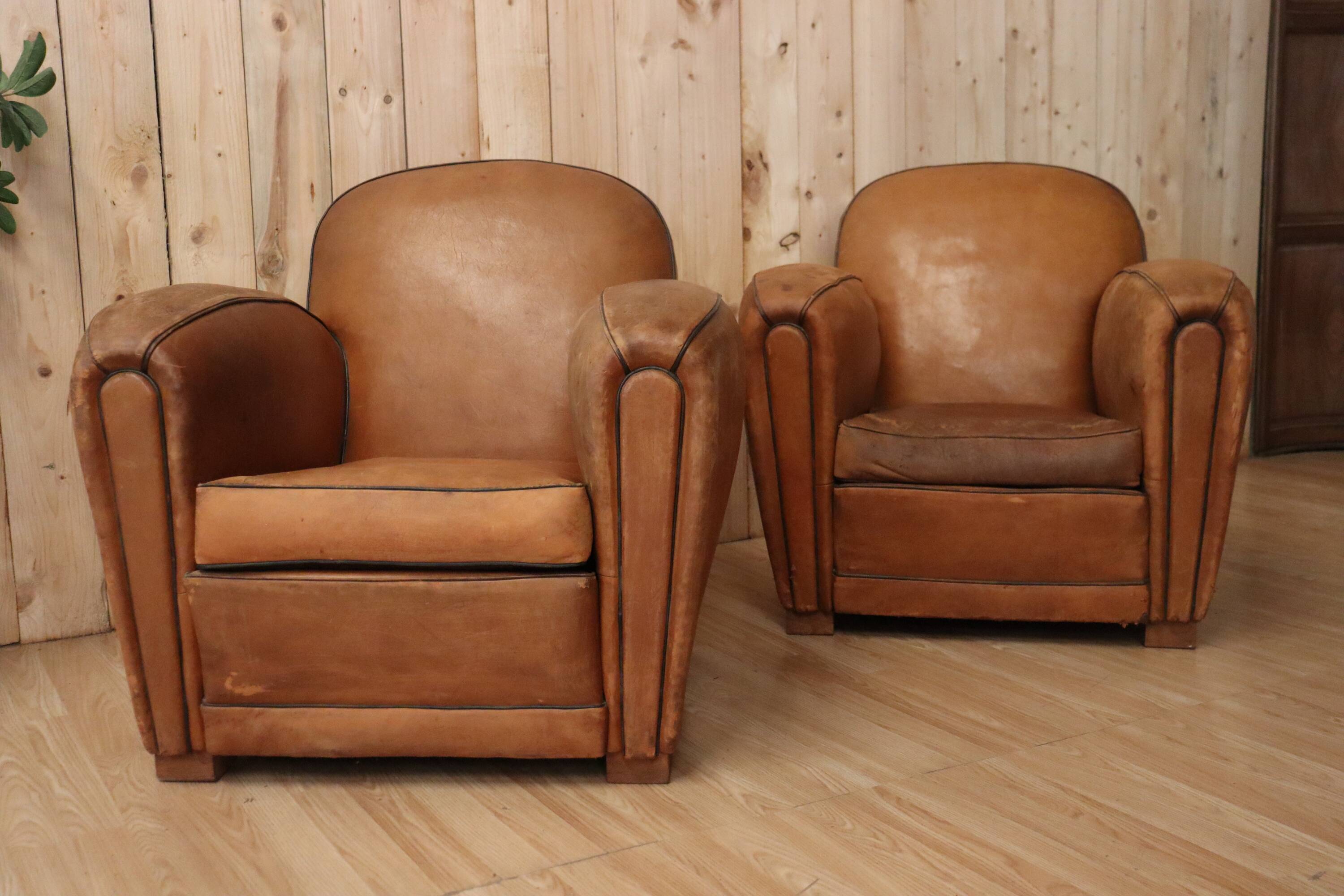 Pair of Art Deco leather club armchairs from the 1930s.