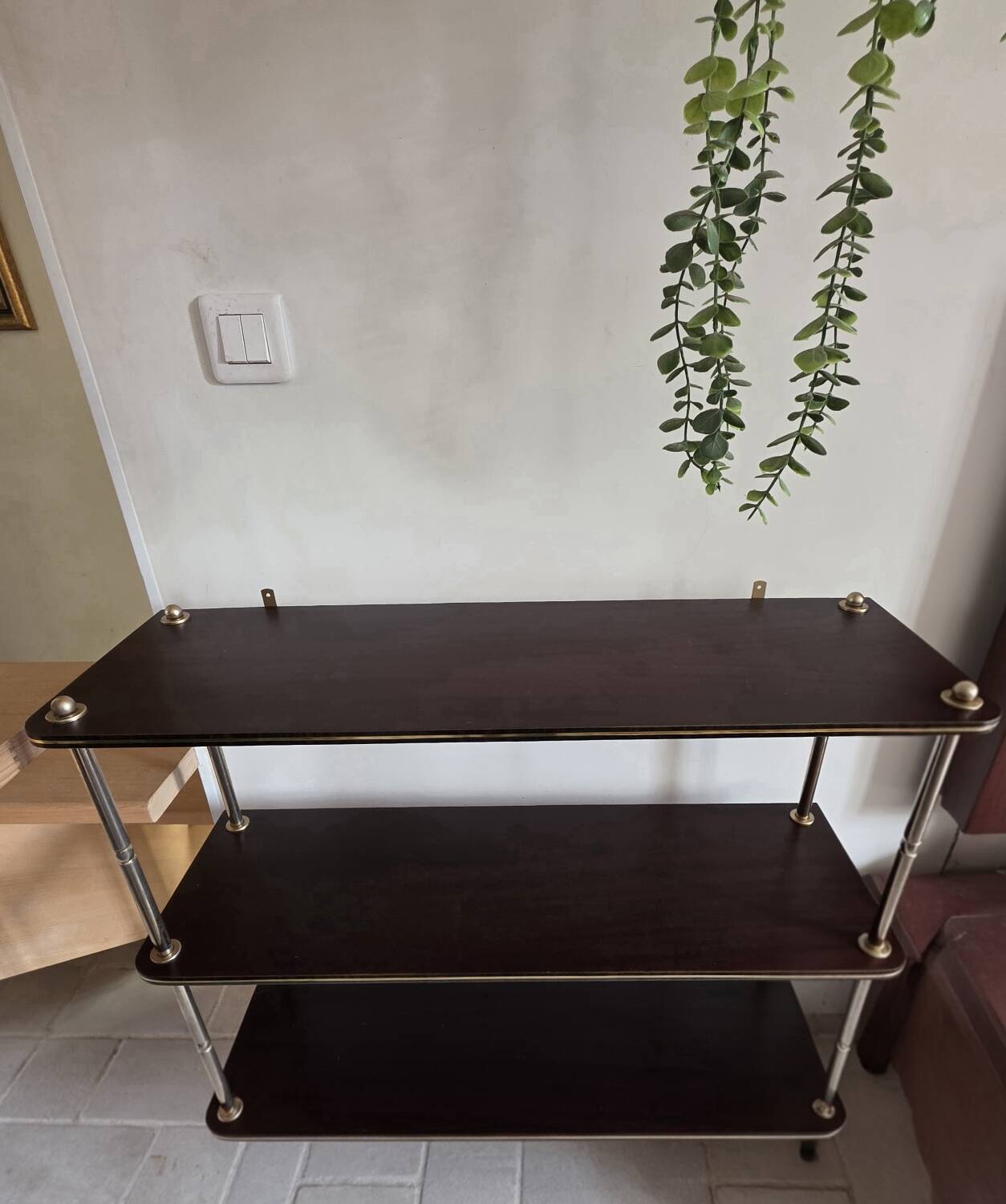 Wooden shelf with gold metal