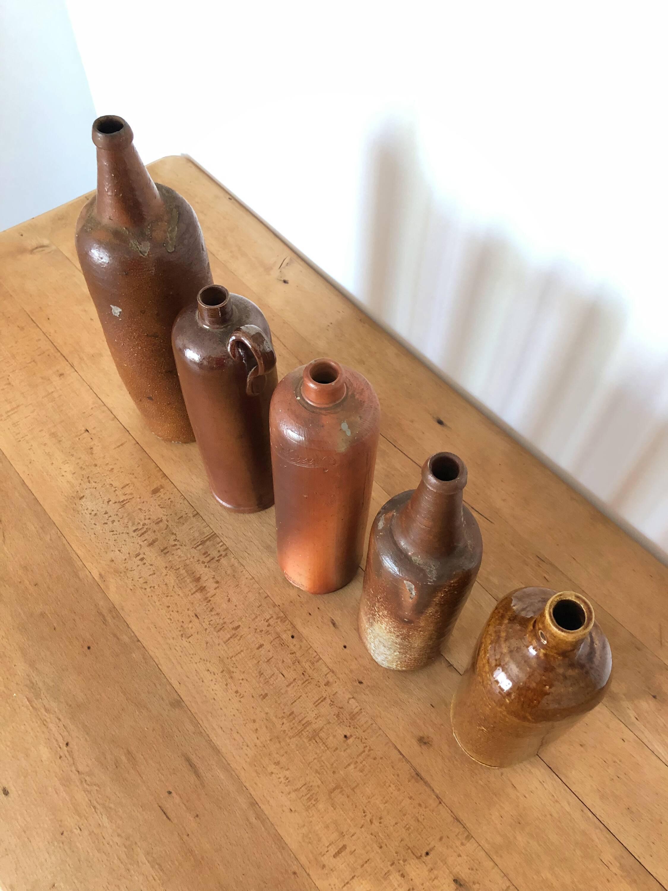 Set of 5 antique glazed stoneware bottles