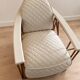 ENNIO armchair in quilted white leather with a copper stainless steel frame.