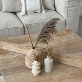 Pair of triangular travertine tables