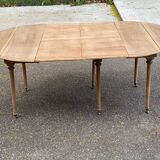 Renovated Louis Philippe round extendable dining table with leaves from the 18th century.