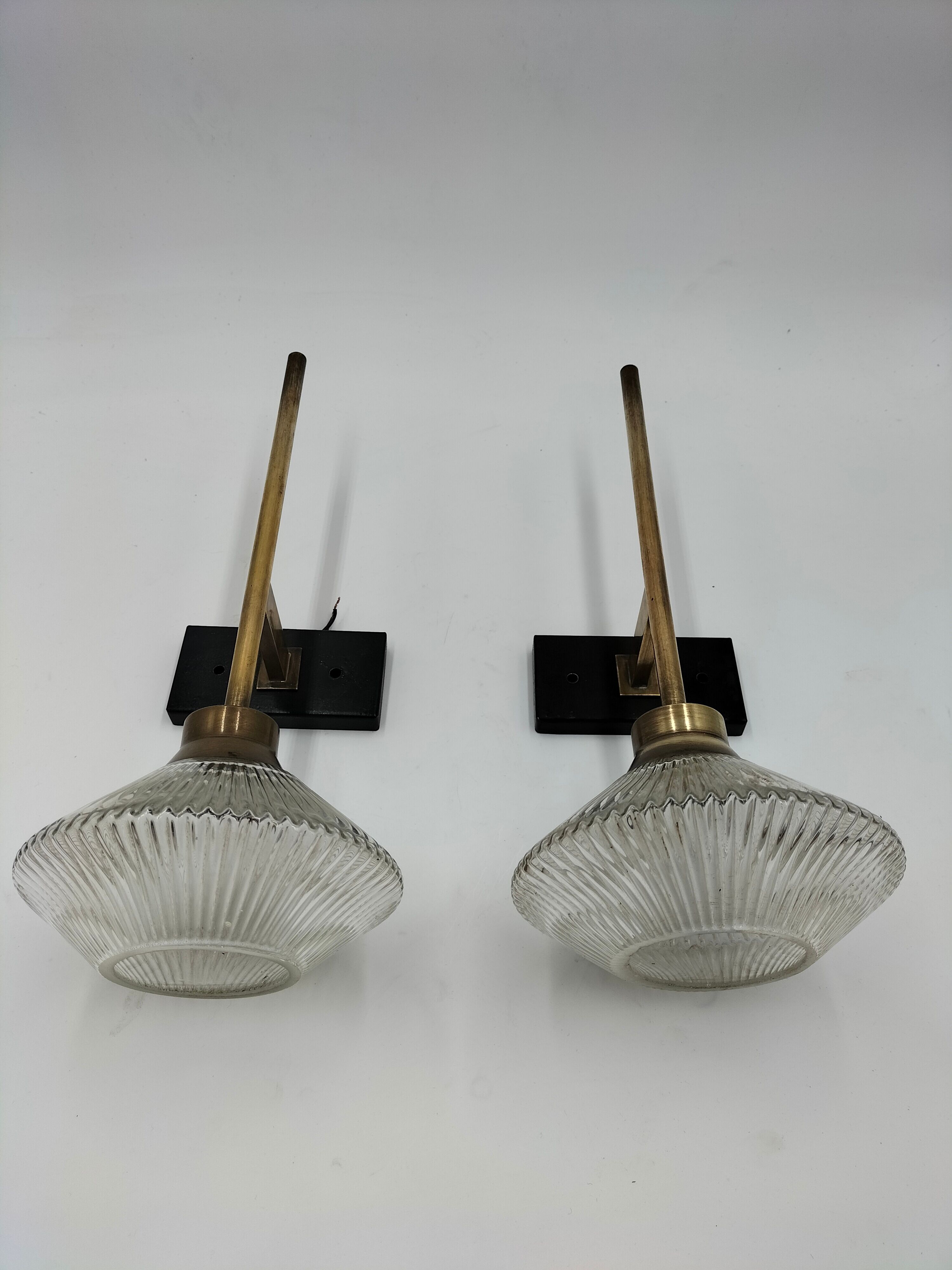 Pair of brass and glass wall lamps