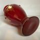 Cameo vase and red cabochons in burgundy glass