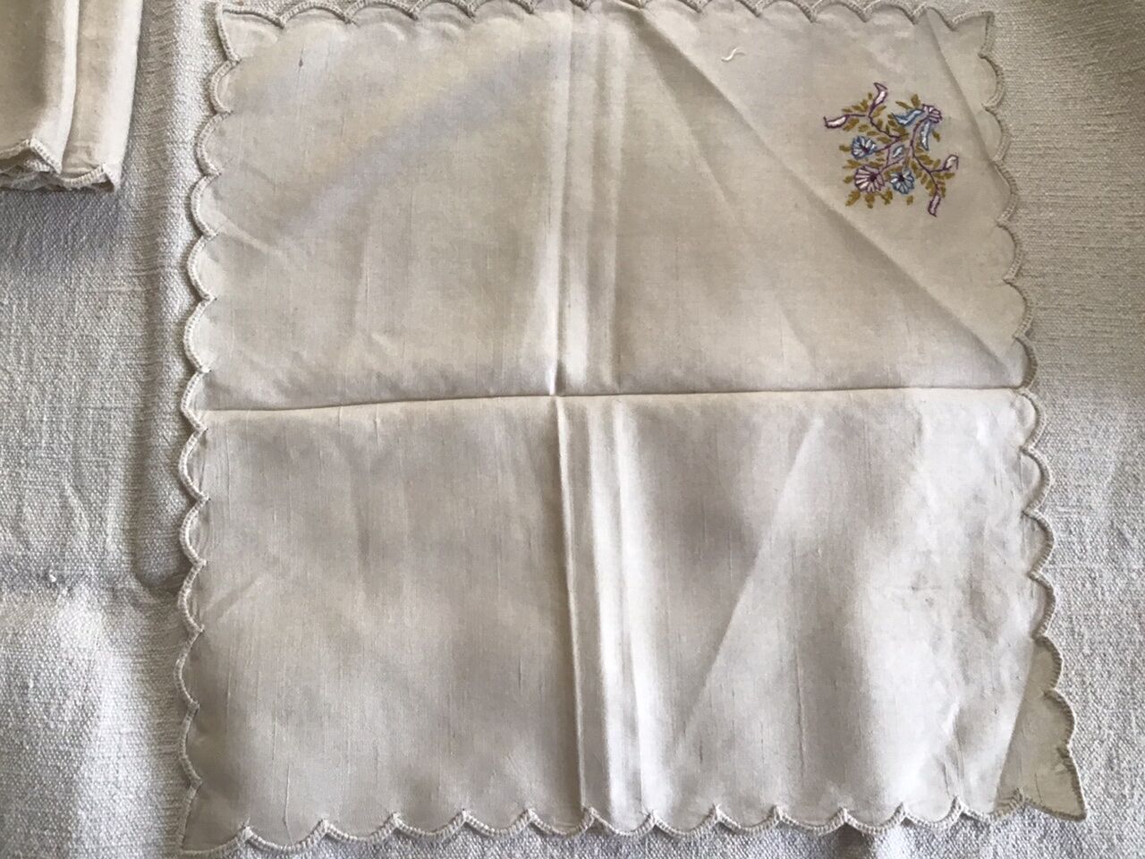 Grey silk nape and towels embroidered with coloured cashmere patterns