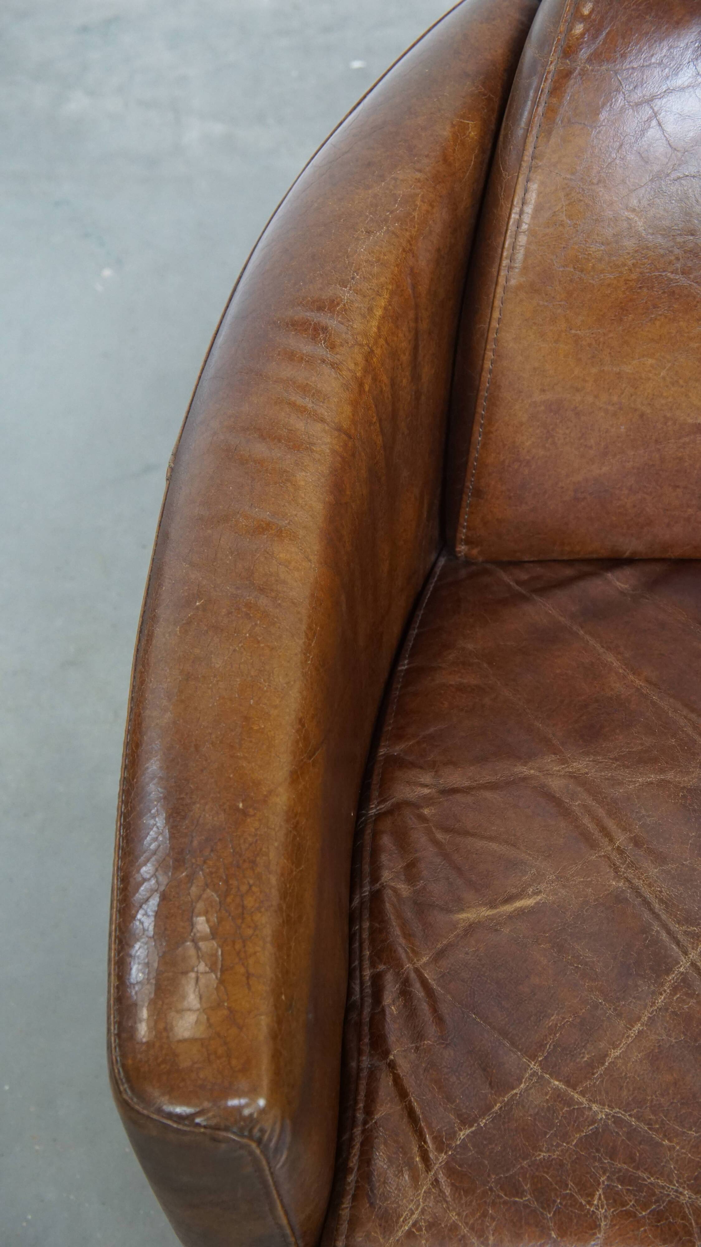 Brown Aviator design armchair made of cowhide leather