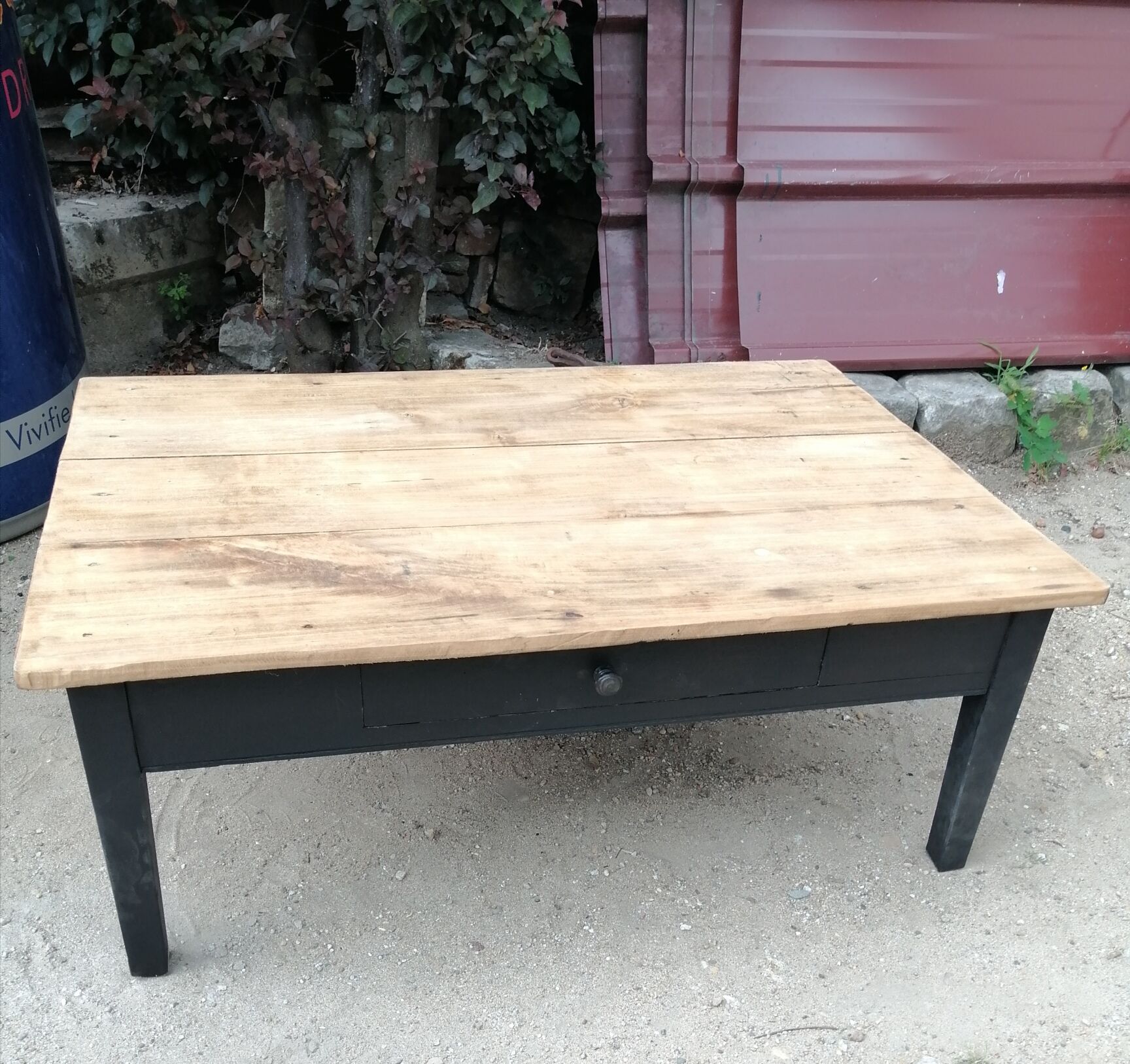 Wooden coffee table with a drawer