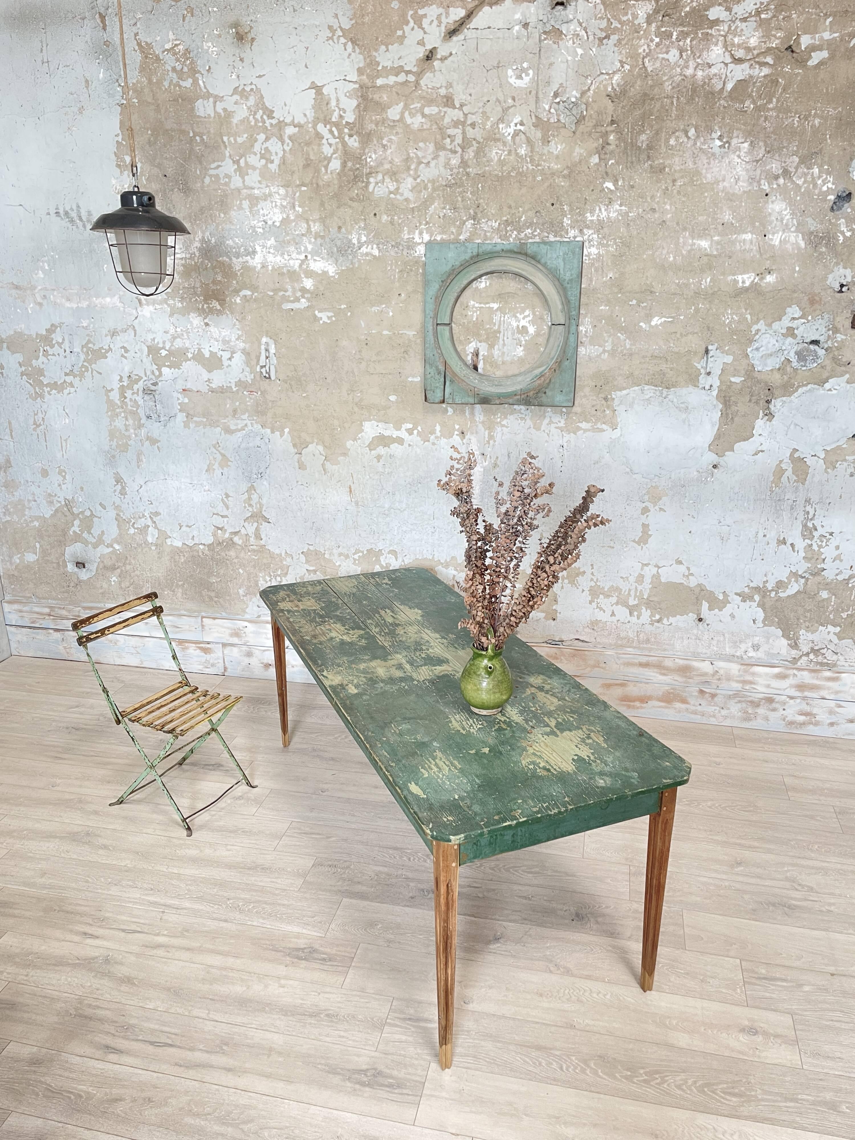 Vintage farm table with spindle legs.