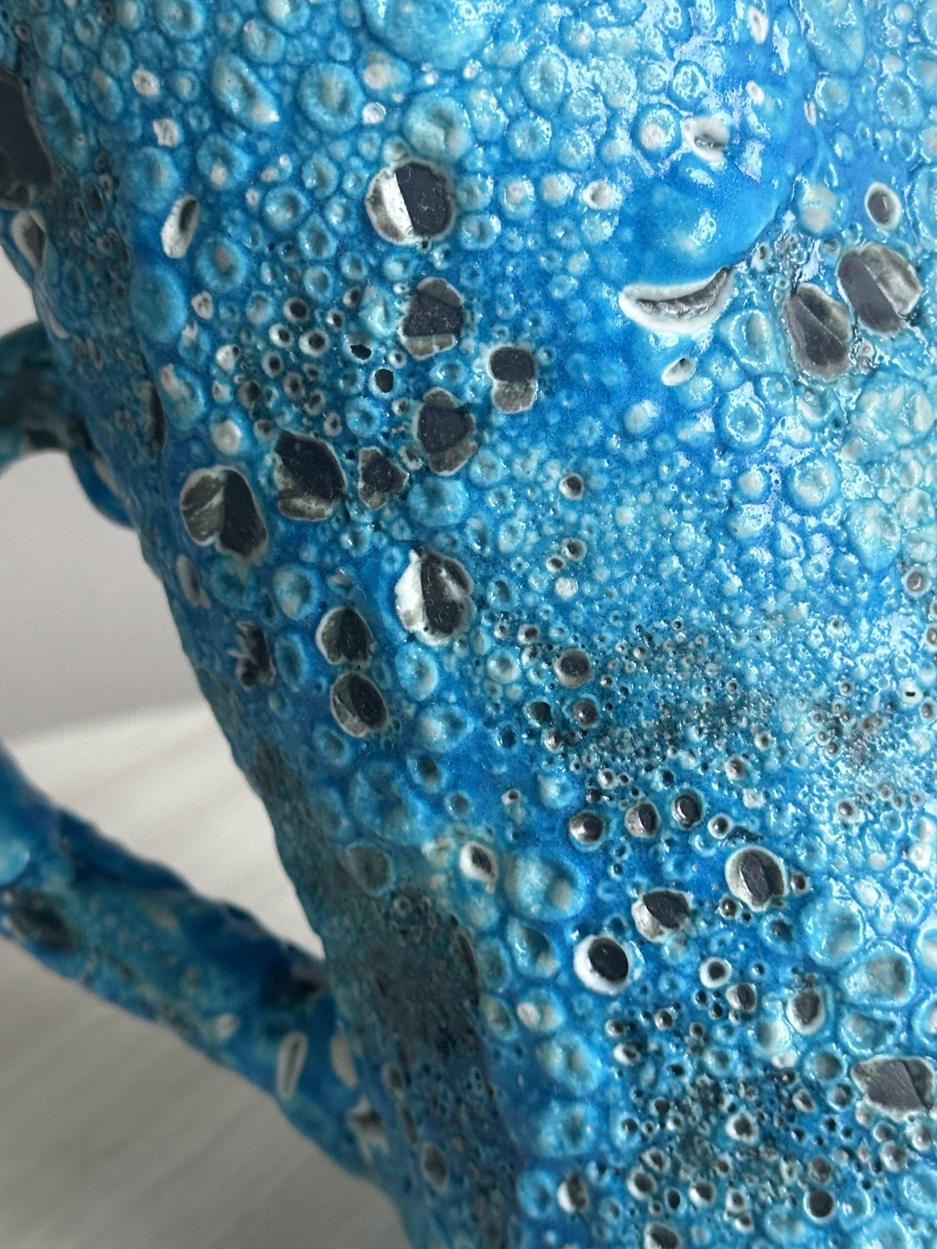 Blue glazed ceramic pitcher