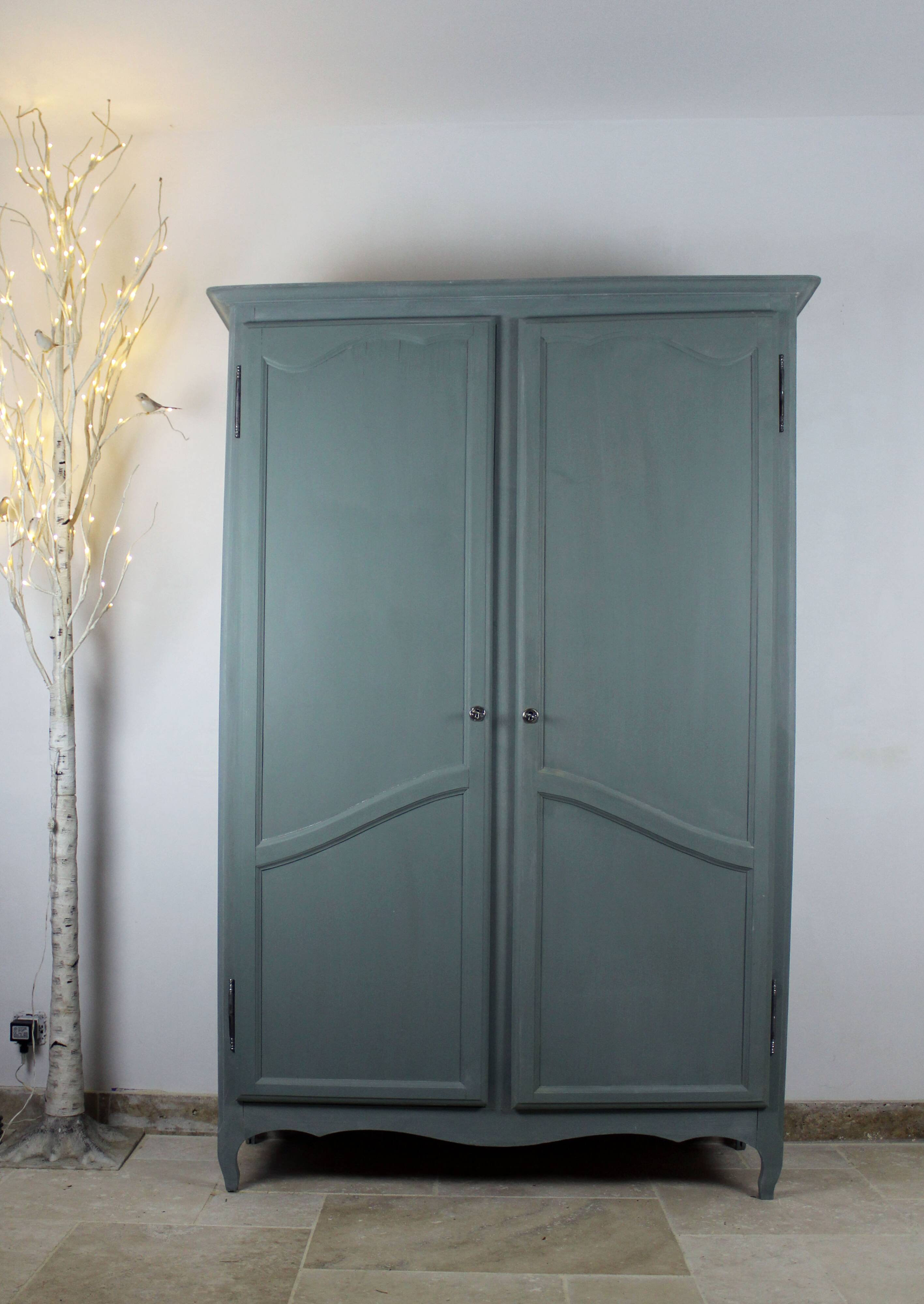 Renovated Parisian wardrobe – sage green with white patina