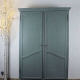 Renovated Parisian wardrobe – sage green with white patina