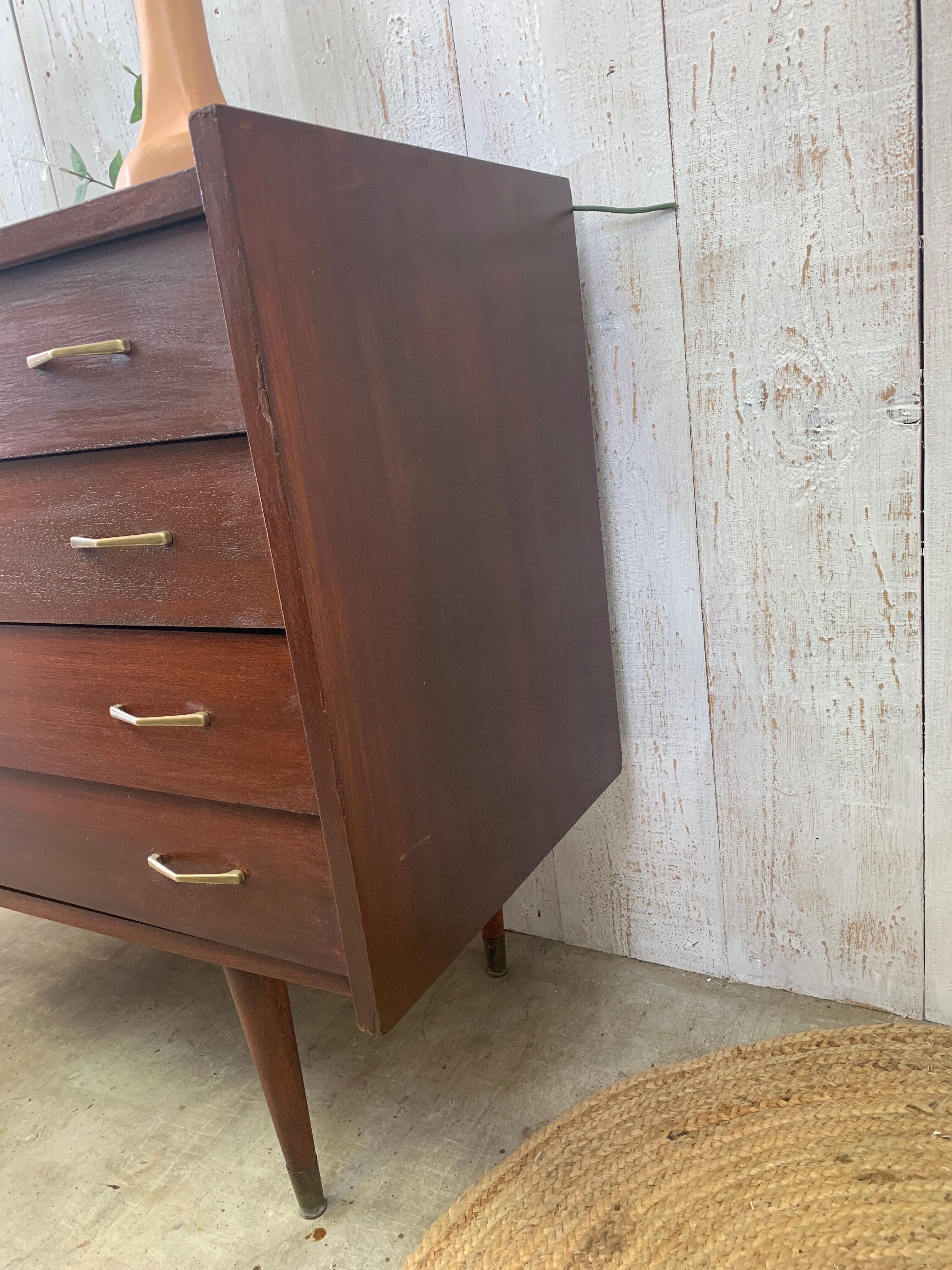 Chest of drawers with tapered feet