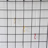 Metal wall coat rack in string design
