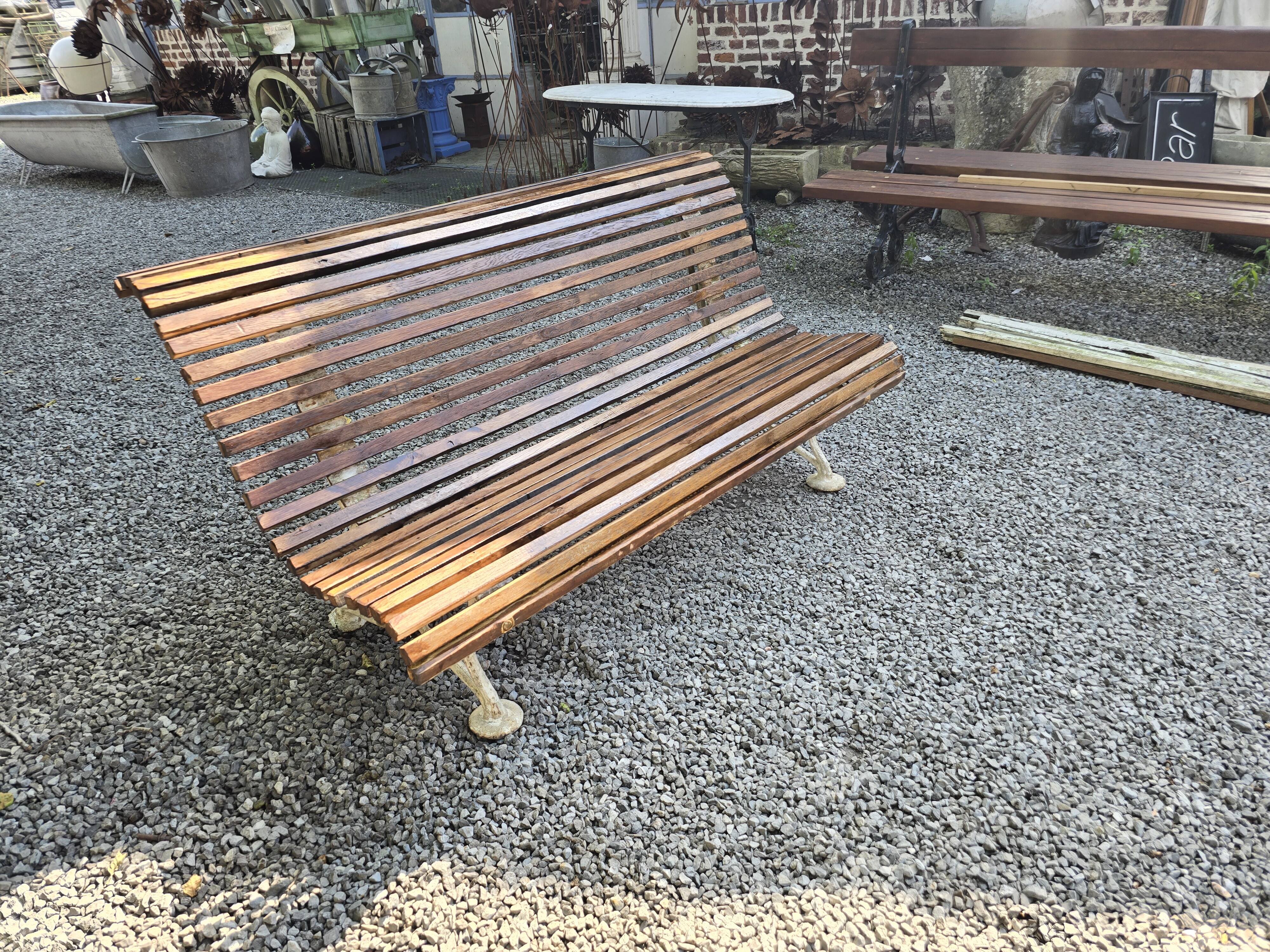 Garden bench with cast iron legs and oak slats