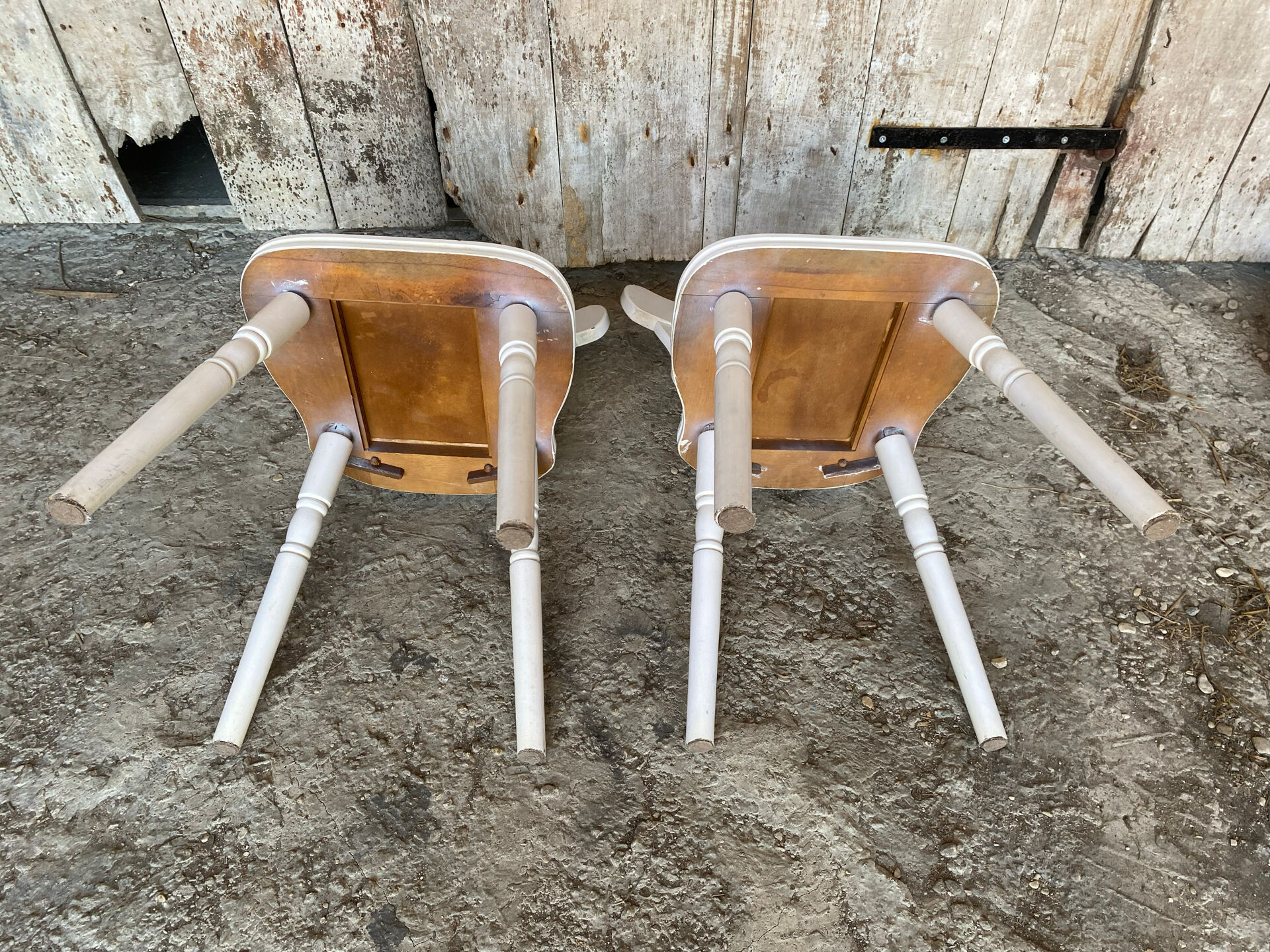 Pair of vintage white wooden bistro chairs