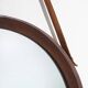 Round wall mirror with leather strap, 1960s