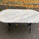 Oval bistro table in marble and petrol black steel, seats 4, 140cm