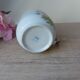 Old ceramic flower cup, vintage bohemian field flowers