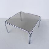 Coffee table with smoked glass top in chromed frame