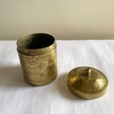 Old round box in chiseled brass