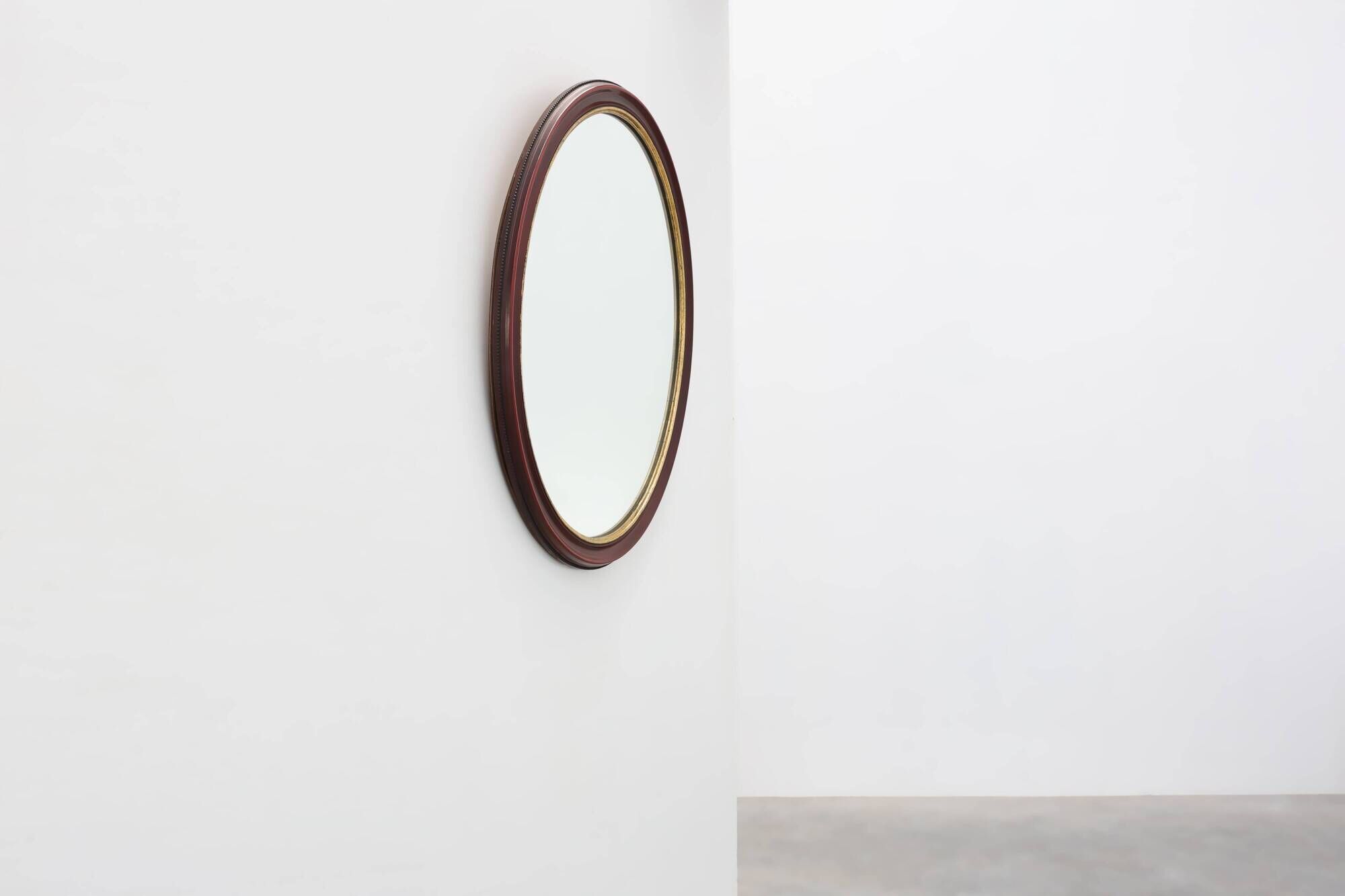 French Burgundy Lacquered Oval Mirror with Gilt Inner Edge, circa 1920
