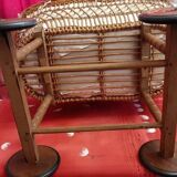 Vintage 1970s wicker cradle on wheels