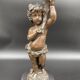 Candelabra with cherub in patinated bronze
