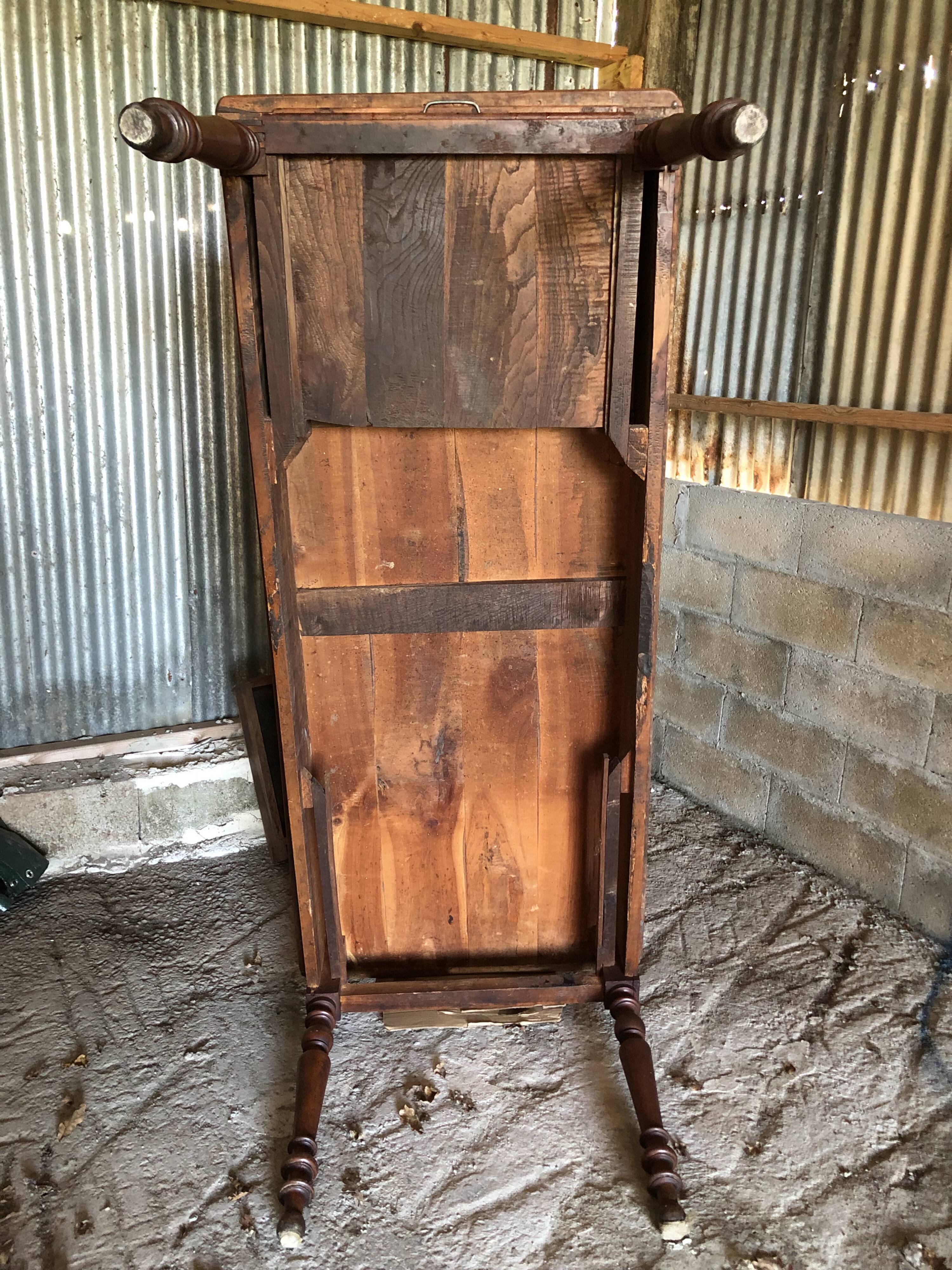 Antique Louis Philippe style farm table in solid cherry wood with turned base.