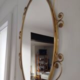 Oval mirror in gilded brass and floral horn, 1950s