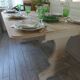 Console table in walnut with drop-leaf extensions, grey patinated base.