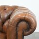 Brown cowhide leather chesterfield armchair  in English style on wheels