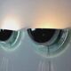 Pair of Bahag wall lights, chrome half-spheres on curved glass, 1980s