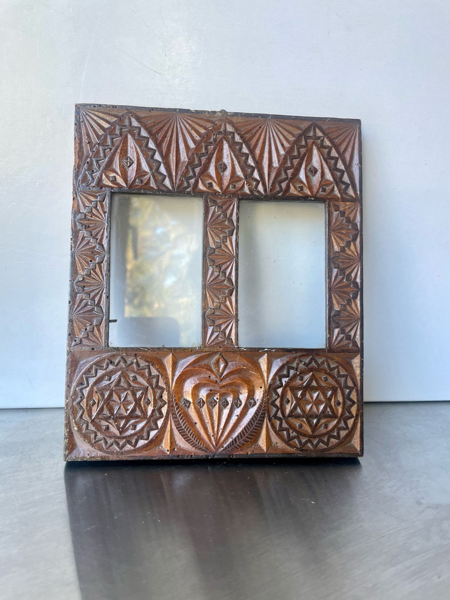 Double frame intricately carved wood