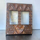 Double frame intricately carved wood