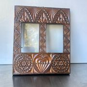 Double frame intricately carved wood