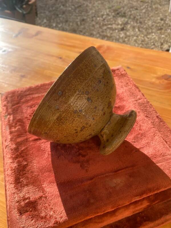 Speckled stoneware bowl on a stand