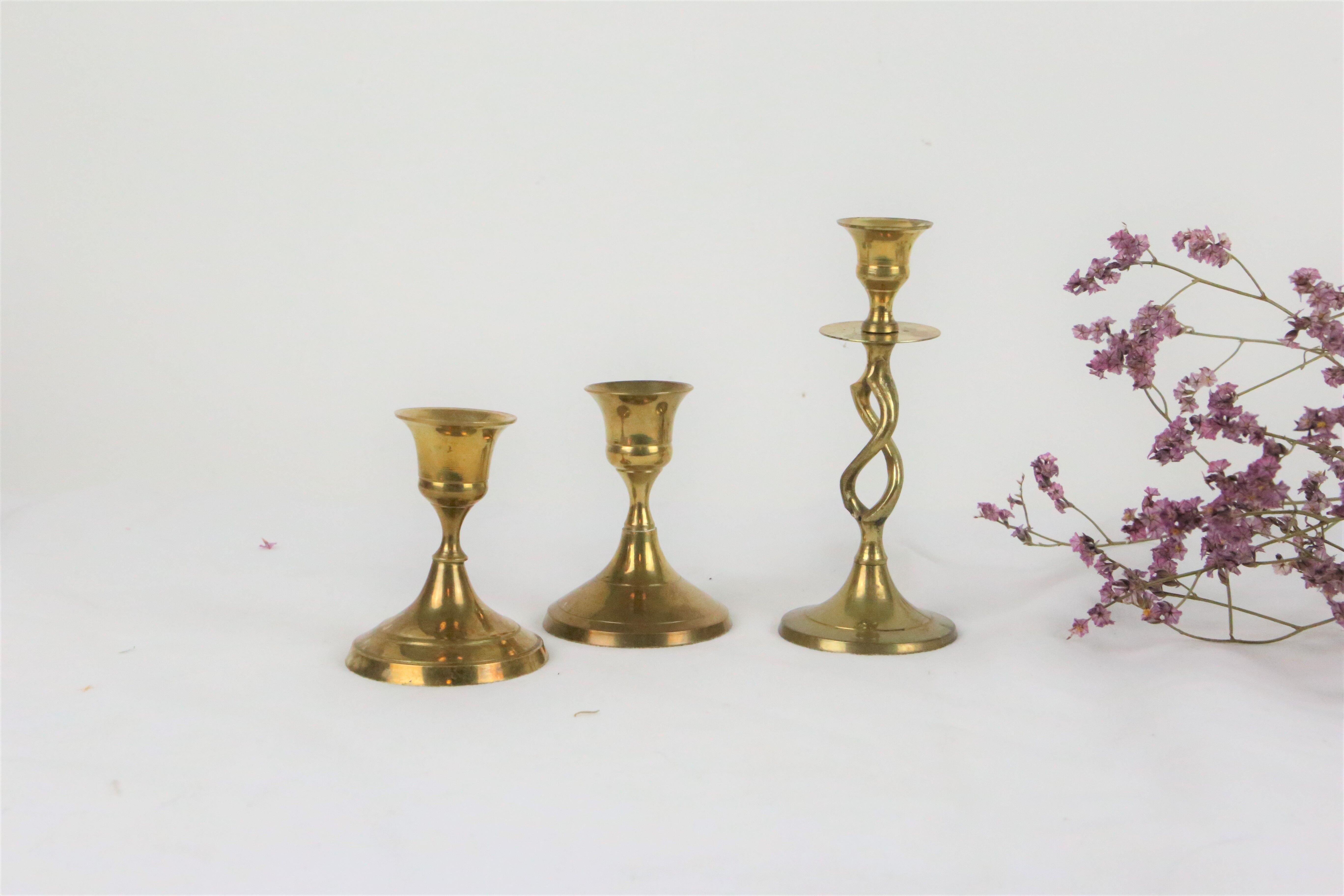Trio of brass candle holders, vintage