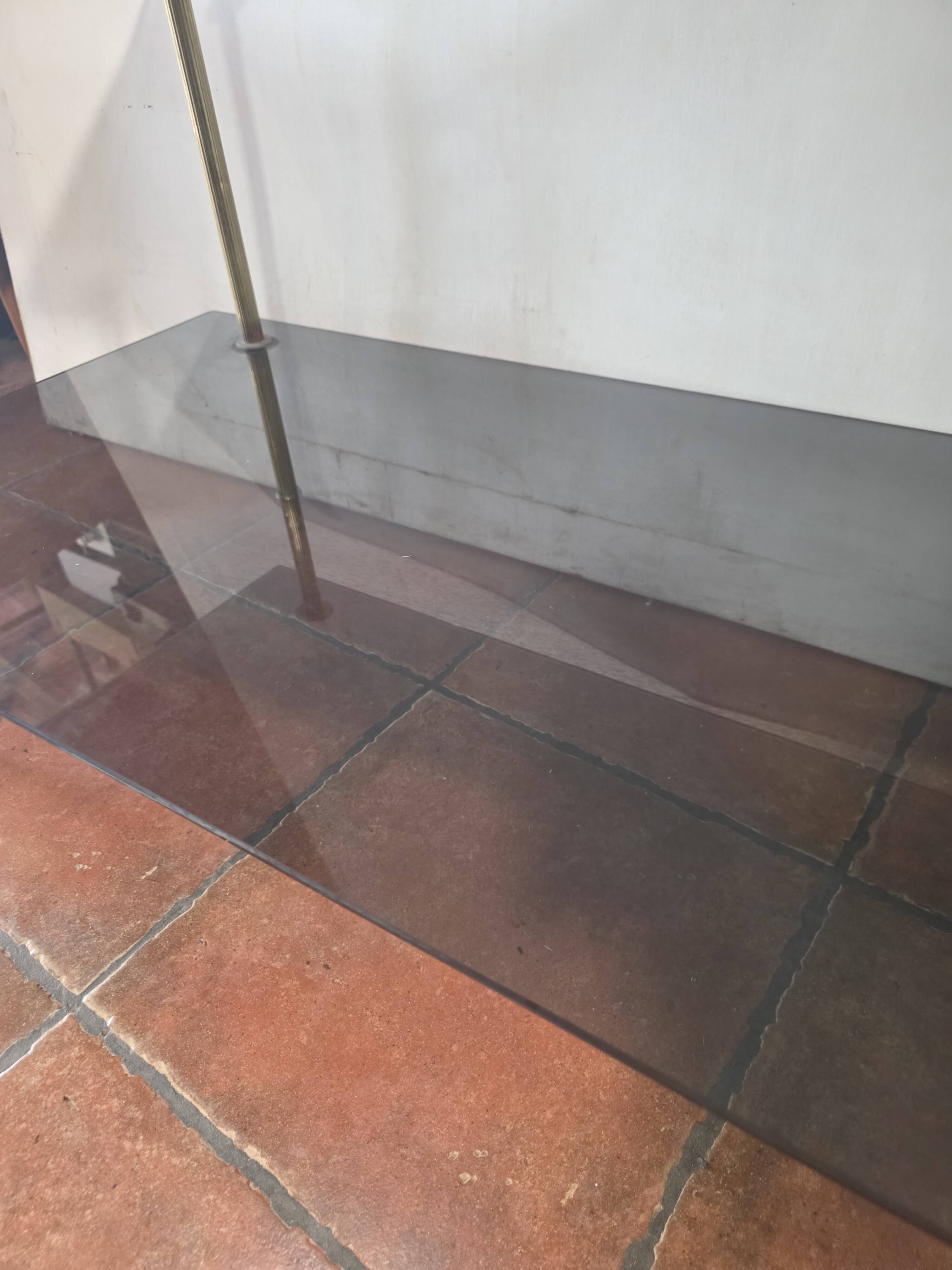 Smoked glass and brass coffee table from the 1970s.