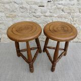 Pair of solid wood tripod stools, carved.