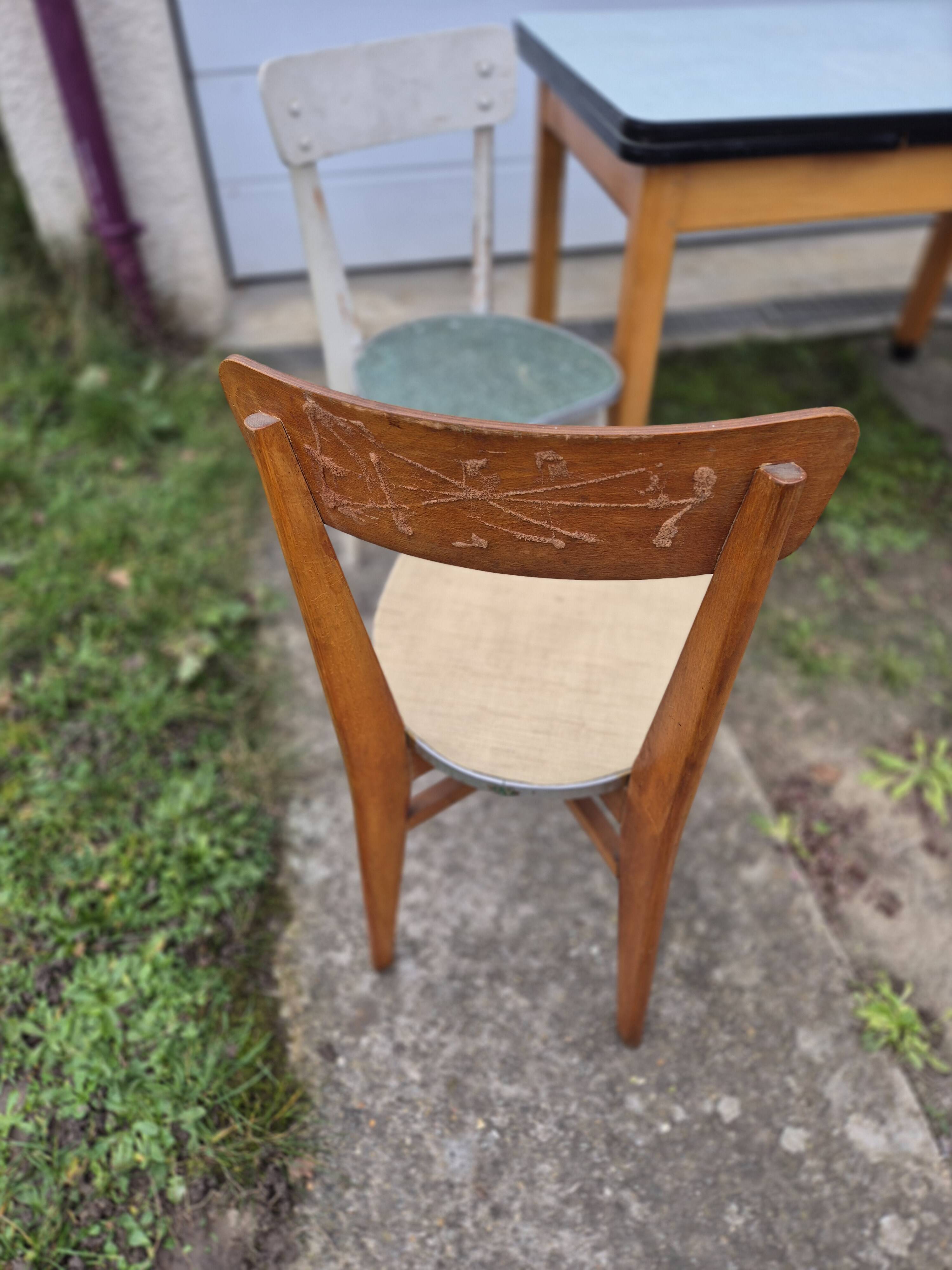 Vintage Scandinavian table and chair set with a wooden frame and formica top.