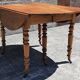Extendable round table (with extensions and flaps), cherry wood.
