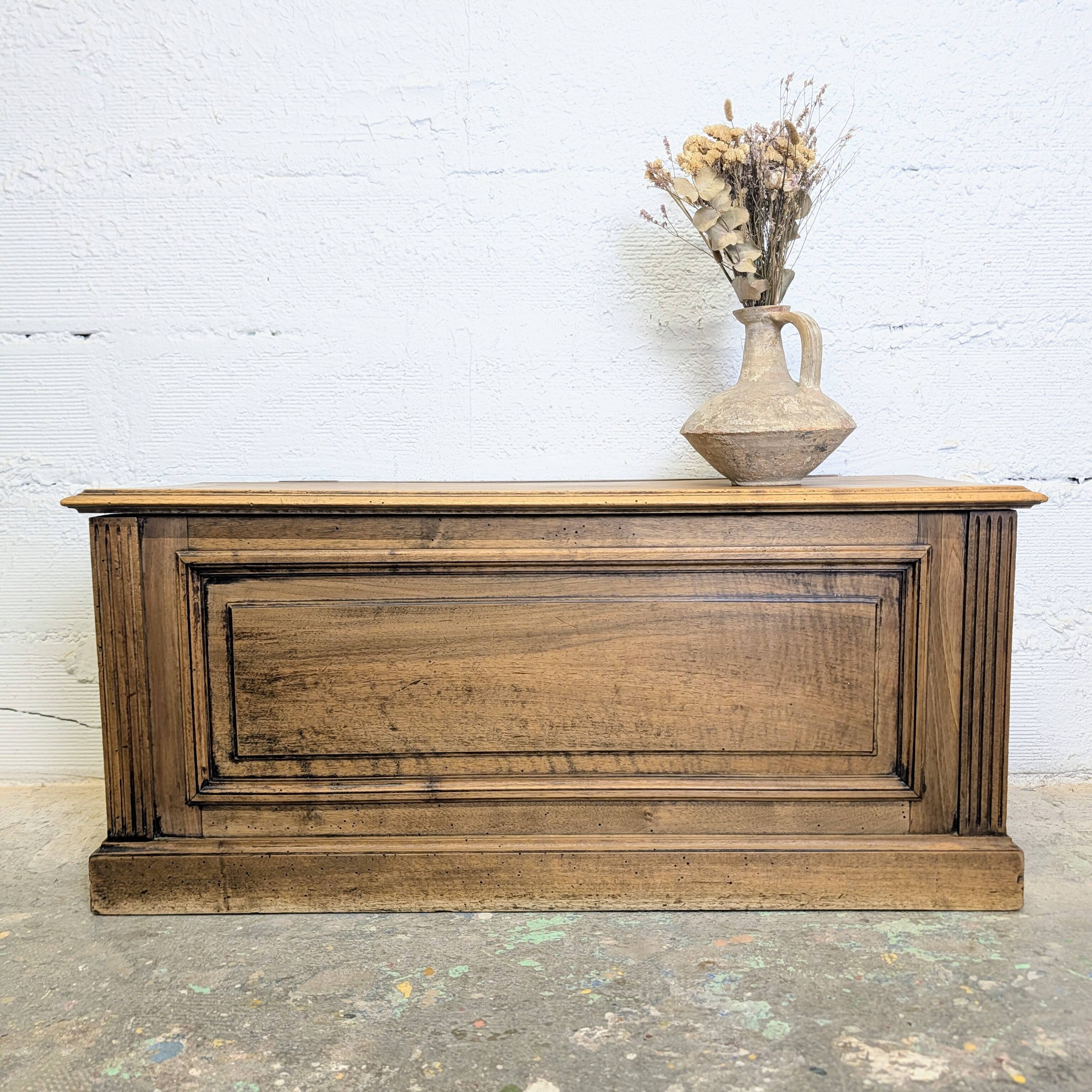Antique wooden chest with moulded panels