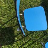 Two blue chairs in formica